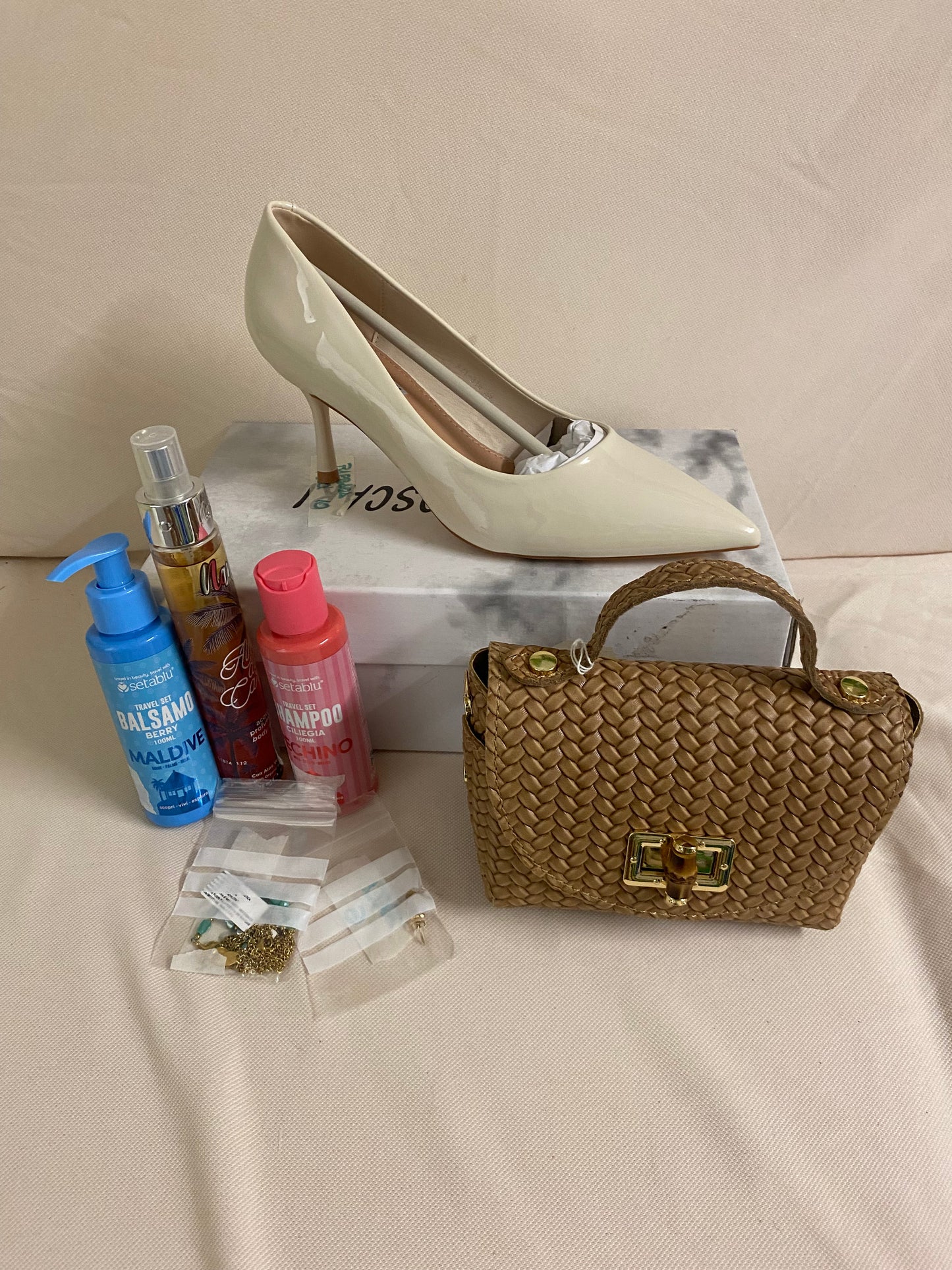 Borsetta scarpe profumi